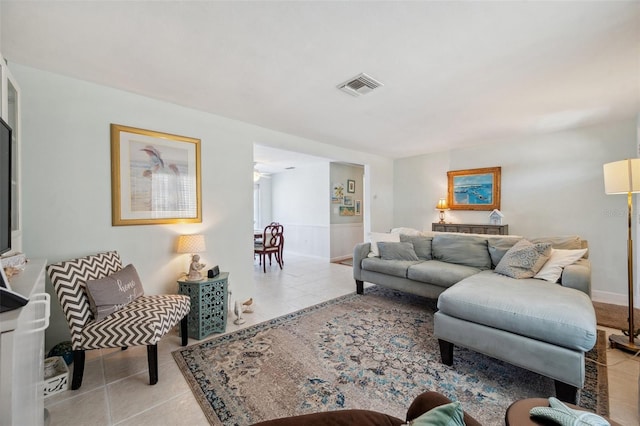 tiled living area featuring visible vents