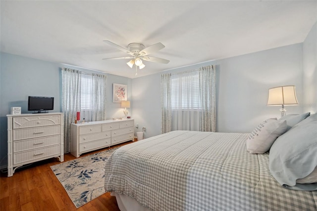 bedroom featuring a ceiling fan and wood finished floors