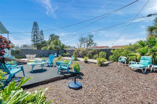 view of yard featuring a patio and a fenced backyard