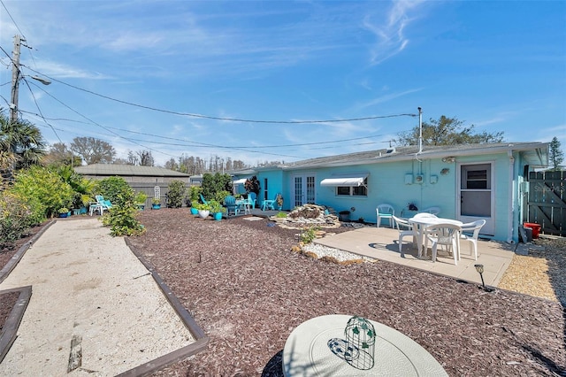 back of house featuring a patio, french doors, and fence