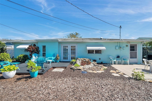 rear view of house featuring french doors and a patio