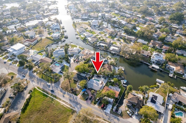 bird's eye view with a residential view and a water view