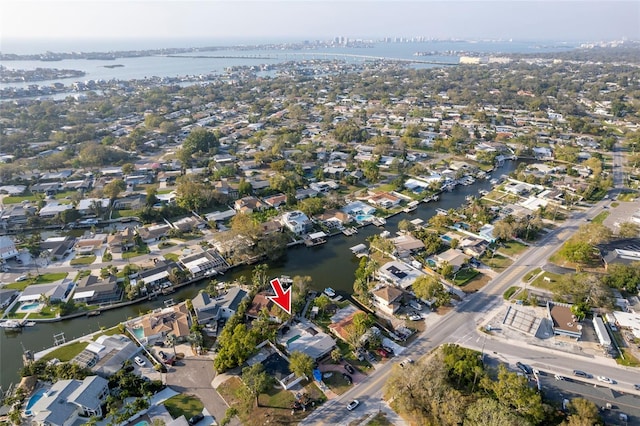 birds eye view of property with a residential view and a water view