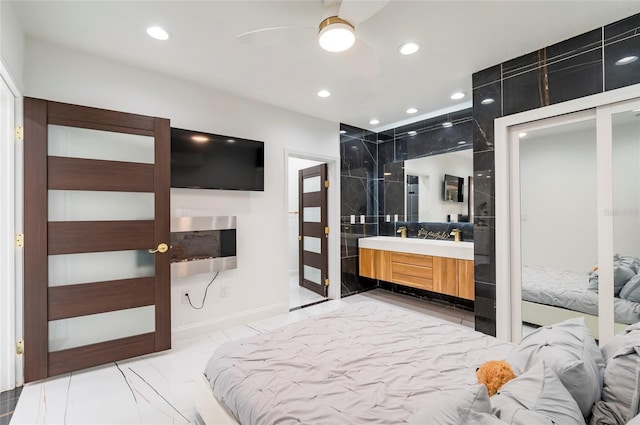 bedroom featuring recessed lighting and marble finish floor