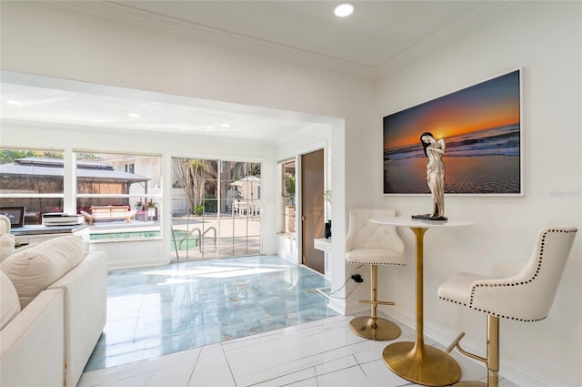 living area featuring recessed lighting, baseboards, marble finish floor, and crown molding