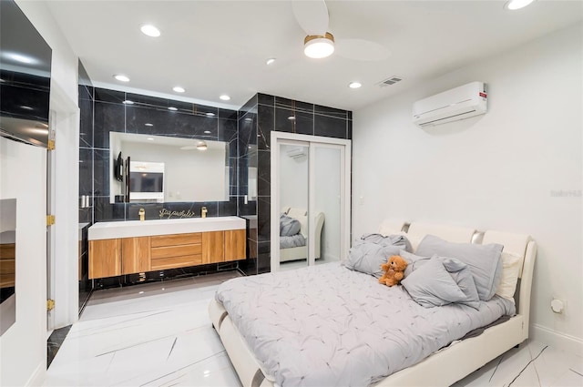 bedroom featuring recessed lighting, marble finish floor, a wall mounted air conditioner, and visible vents