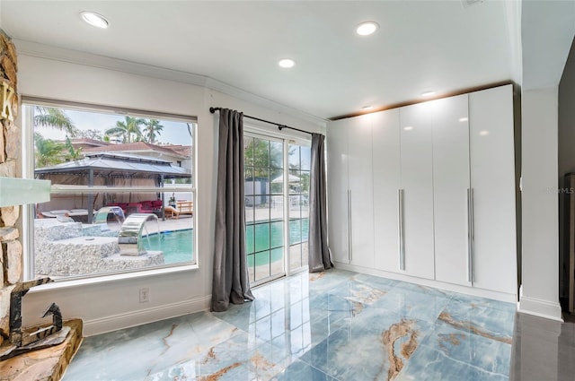 empty room featuring crown molding, recessed lighting, baseboards, and marble finish floor