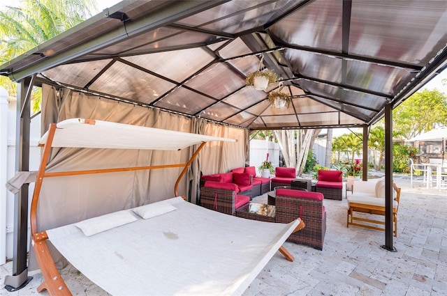 view of patio / terrace with a gazebo, outdoor lounge area, and fence