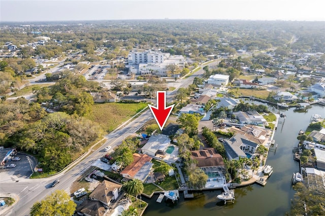 bird's eye view featuring a residential view and a water view