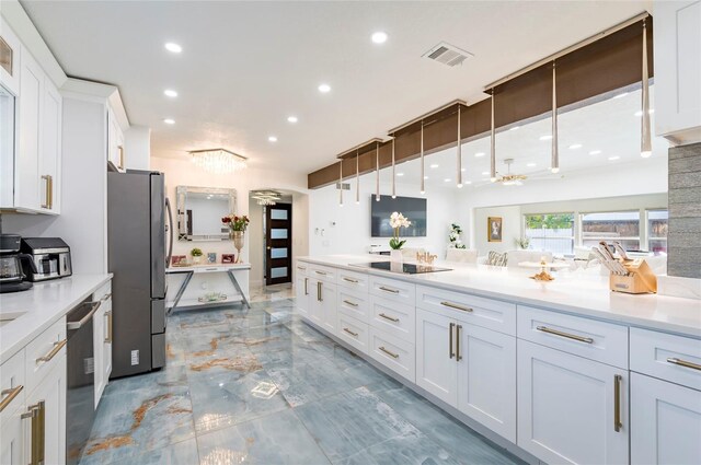 kitchen with dishwashing machine, visible vents, freestanding refrigerator, white cabinetry, and black electric cooktop