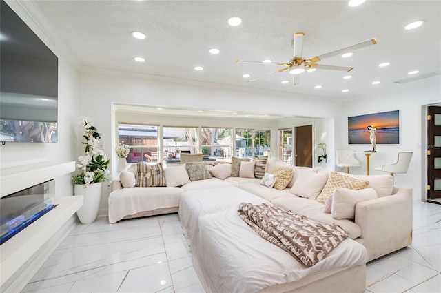 bedroom featuring a glass covered fireplace, recessed lighting, crown molding, and ceiling fan