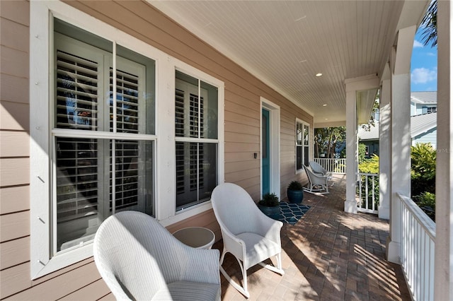 5616 Seagrass Pl, Apollo Beach, FL 33572 - wooden deck featuring covered porch