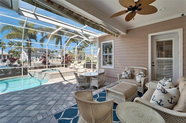 5616 Seagrass Pl, Apollo Beach, FL 33572 - view of patio featuring a lanai, a pool with connected hot tub, an outdoor hangout area, and a ceiling fan