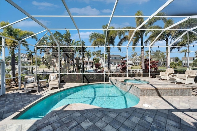 5616 Seagrass Pl, Apollo Beach, FL 33572 - view of swimming pool featuring a patio area, a pool with connected hot tub, and glass enclosure