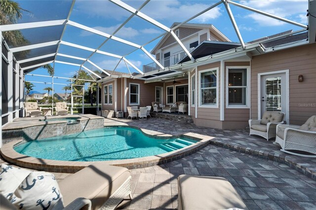 5616 Seagrass Pl, Apollo Beach, FL 33572 - view of swimming pool featuring a patio, a pool with connected hot tub, a lanai, and an outdoor living space