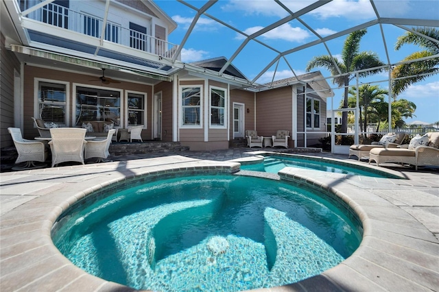 5616 Seagrass Pl, Apollo Beach, FL 33572 - view of pool featuring a ceiling fan, a patio, an outdoor hangout area, outdoor dining area, and a pool with connected hot tub