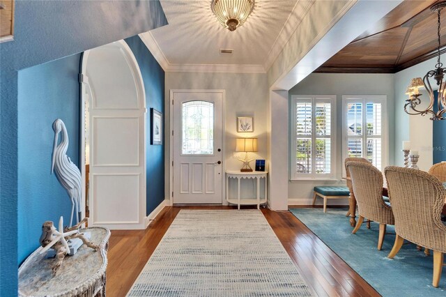 5616 Seagrass Pl, Apollo Beach, FL 33572 - entryway with a chandelier, a healthy amount of sunlight, hardwood / wood-style flooring, and crown molding