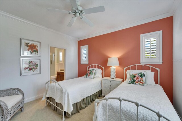 5616 Seagrass Pl, Apollo Beach, FL 33572 - carpeted bedroom with a ceiling fan, crown molding, ensuite bath, and baseboards