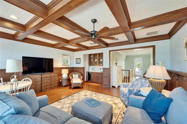 5616 Seagrass Pl, Apollo Beach, FL 33572 - living area featuring coffered ceiling, beamed ceiling, and wainscoting