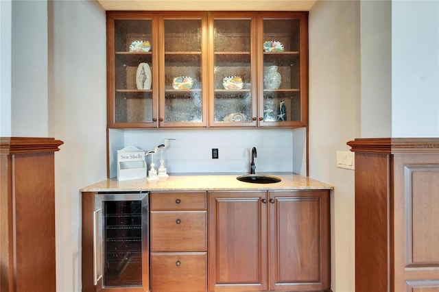 5616 Seagrass Pl, Apollo Beach, FL 33572 - bar featuring beverage cooler, indoor wet bar, and a sink