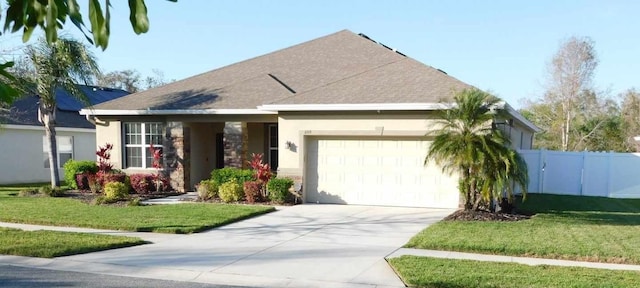 single story home featuring a garage, driveway, fence, and a front lawn