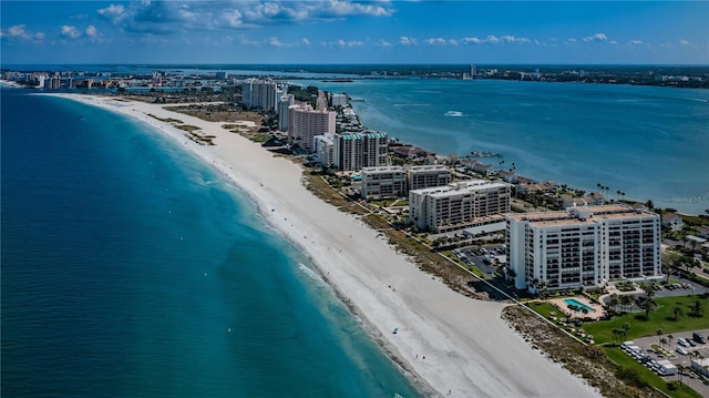 bird's eye view featuring a water view, a city view, and a view of the beach