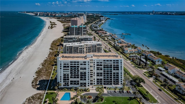 birds eye view of property with a beach view and a water view