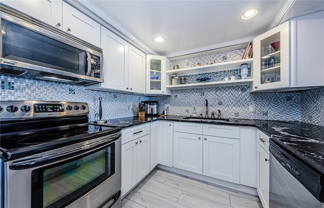 kitchen featuring a sink, open shelves, backsplash, and stainless steel appliances