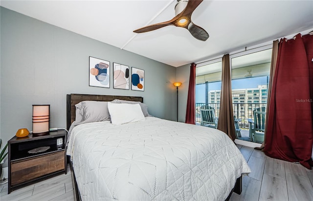 bedroom with light wood-style flooring, ceiling fan, and access to outside