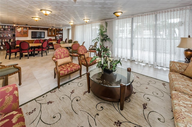 living area with tile patterned floors