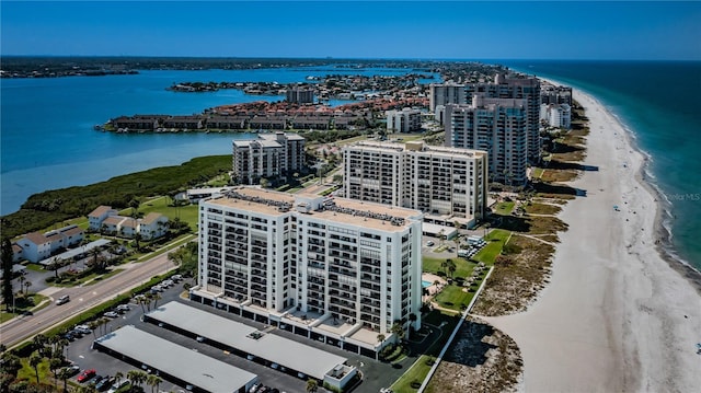 bird's eye view with a water view, a view of city, and a view of the beach