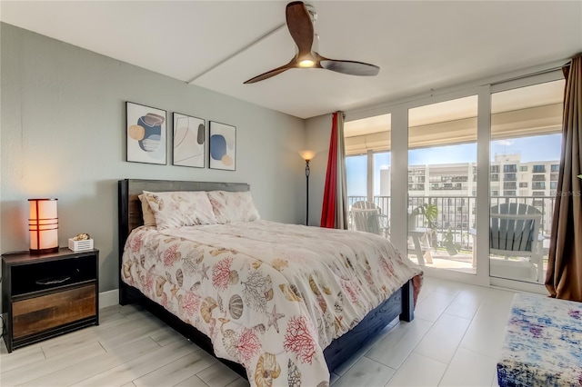 1460 Gulf Blvd Unit 506, Clearwater Beach, FL 33767 - bedroom with access to exterior and a ceiling fan