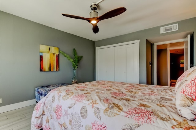 1460 Gulf Blvd Unit 506, Clearwater Beach, FL 33767 - bedroom featuring a closet, wood finished floors, and ceiling fan