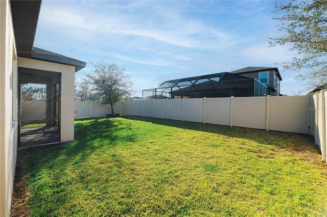 view of yard with a fenced backyard