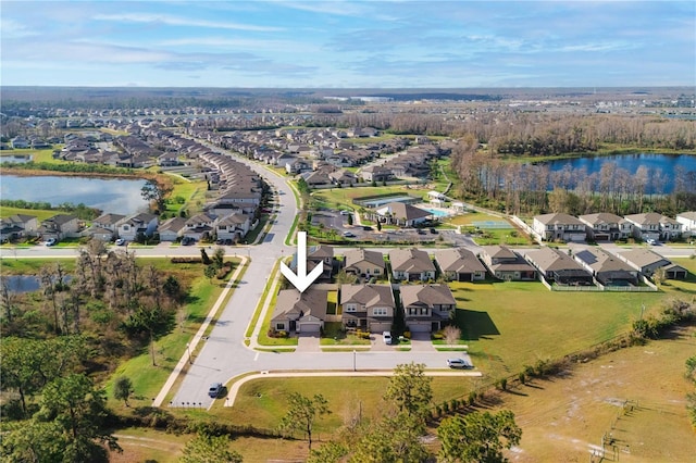 aerial view with a water view and a residential view