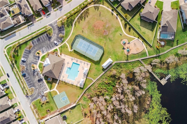 bird's eye view featuring a water view and a residential view