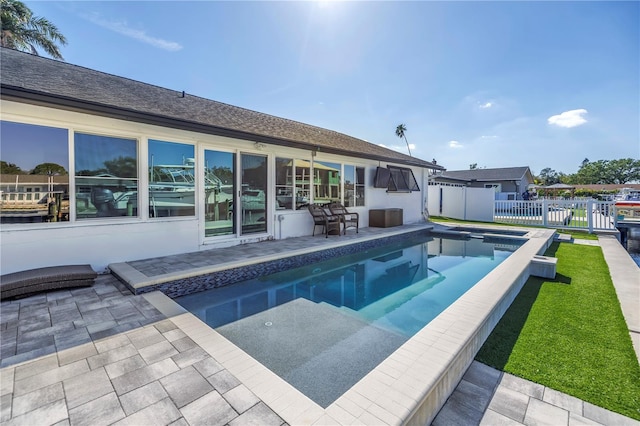 view of swimming pool with a patio area, fence, and a fenced in pool