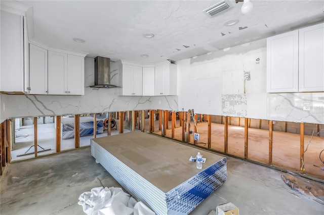 miscellaneous room with concrete floors and visible vents