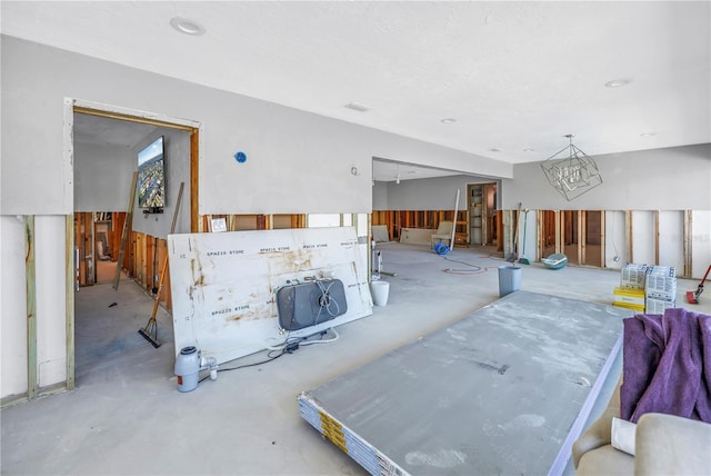 living area with concrete flooring