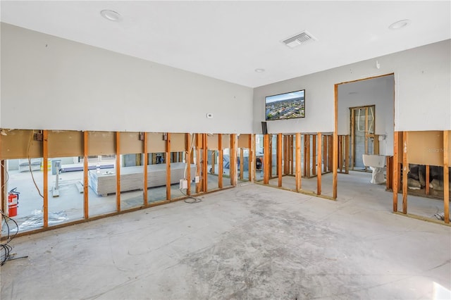 spare room with concrete floors and visible vents