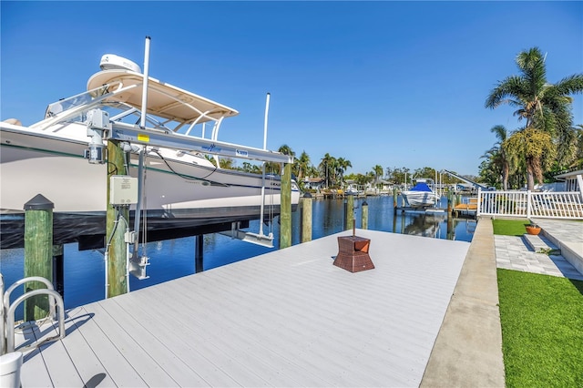 view of dock with a water view and boat lift