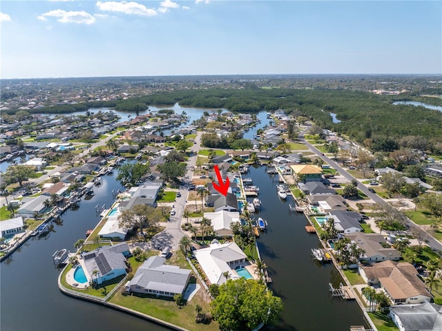 birds eye view of property featuring a water view and a residential view