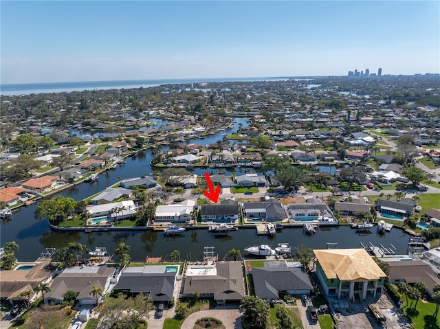 bird's eye view with a water view and a residential view