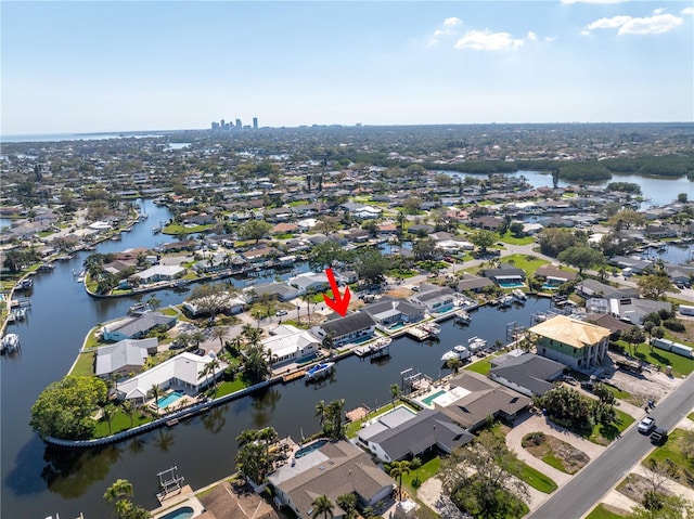 birds eye view of property with a residential view and a water view