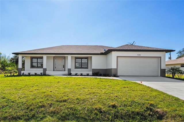 ranch-style house with a garage, driveway, a front yard, and stucco siding