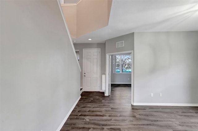 unfurnished room with recessed lighting, wood finished floors, visible vents, and baseboards