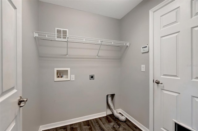 laundry area featuring hookup for an electric dryer, laundry area, dark wood-type flooring, washer hookup, and baseboards