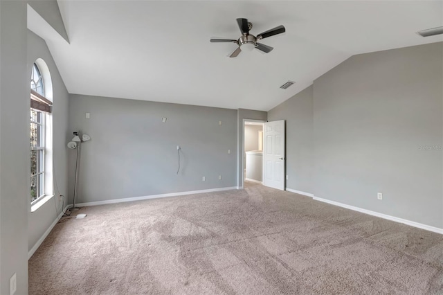 unfurnished room with carpet, visible vents, baseboards, and a ceiling fan