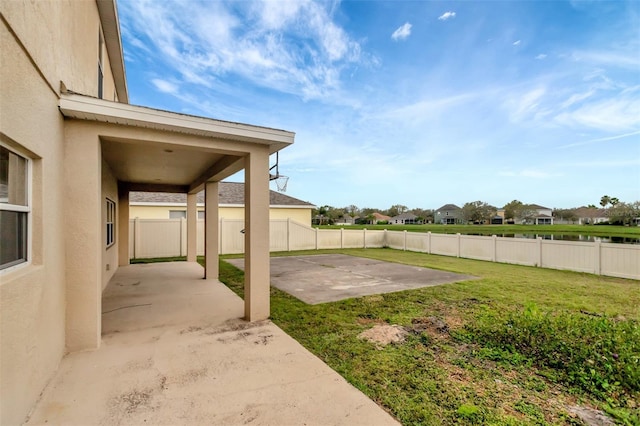 view of yard with a patio area and a fenced backyard