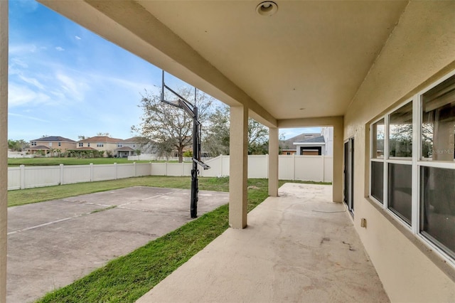 view of patio with a residential view and a fenced backyard